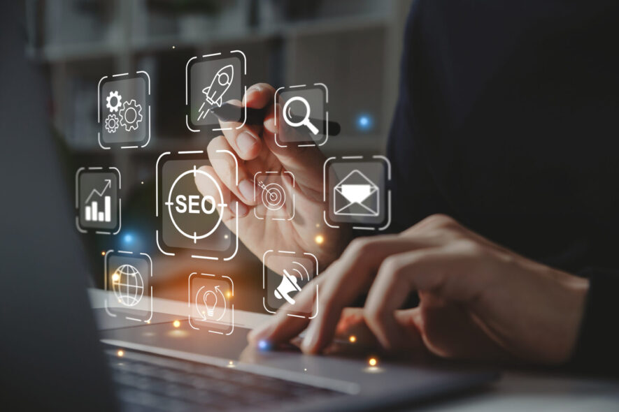 Hand of businessman holding a pen pointing to SEO Search Engine